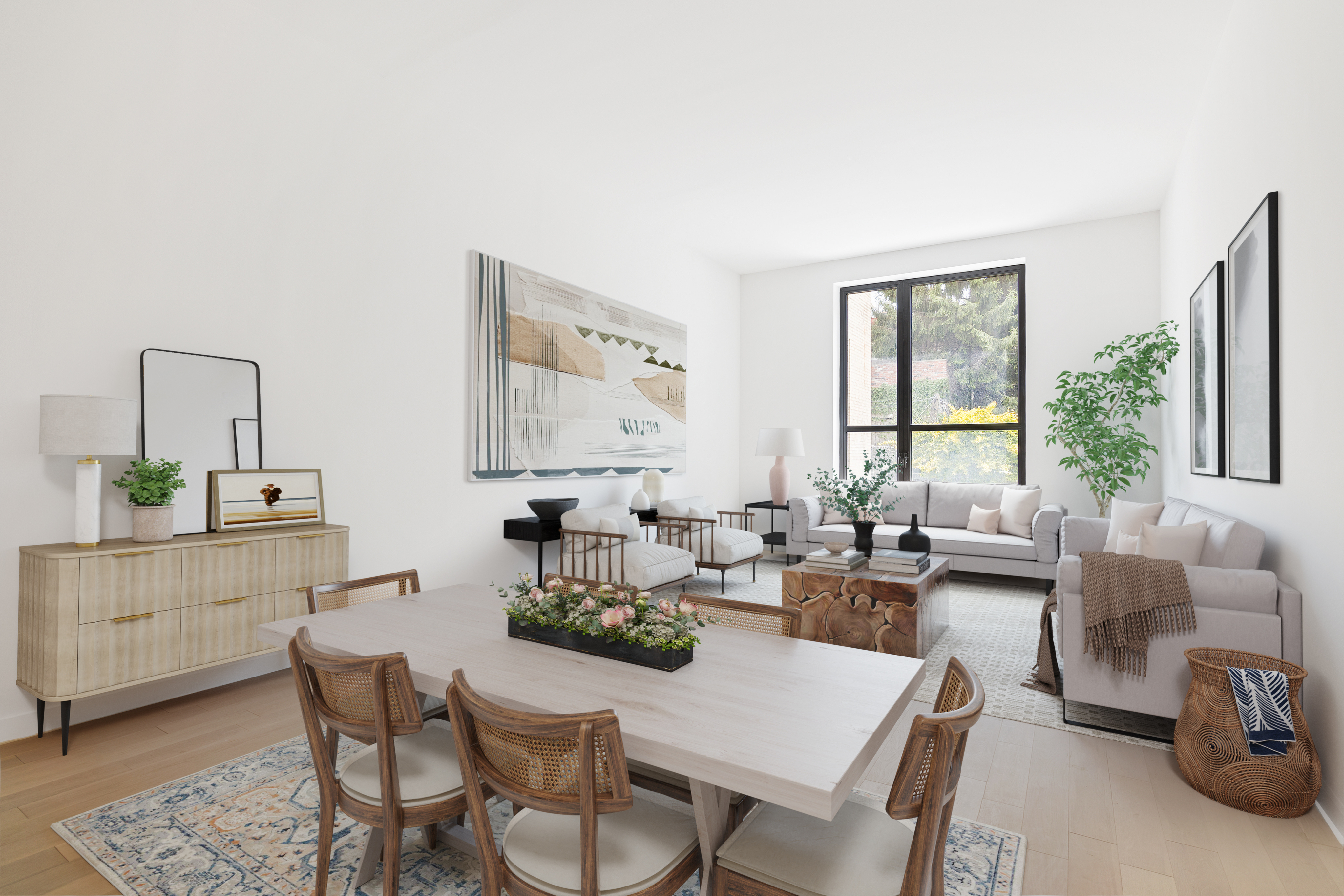 Bright staged living and dining area with modern furniture and natural light